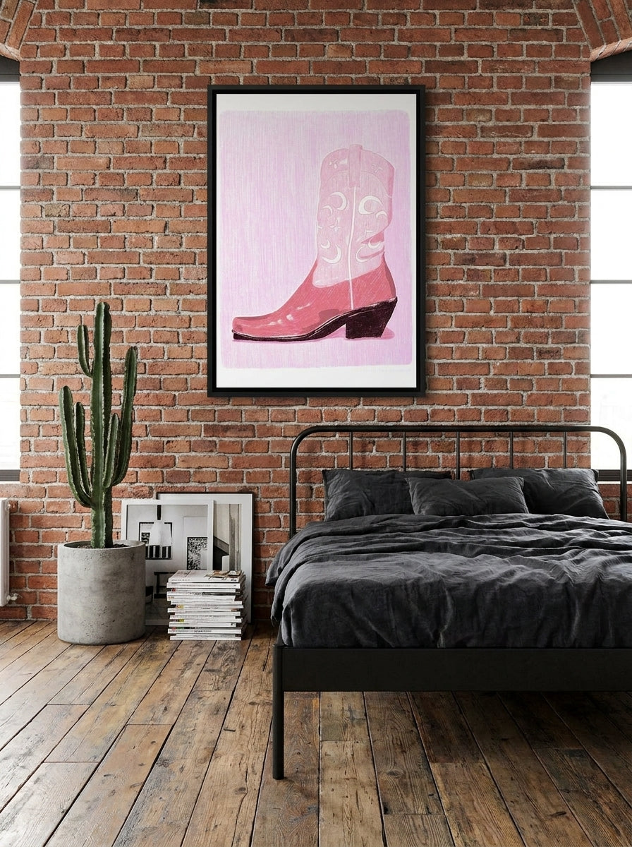 Canvas wall art with a black surround styled on the wall in an industrial loft bedroom