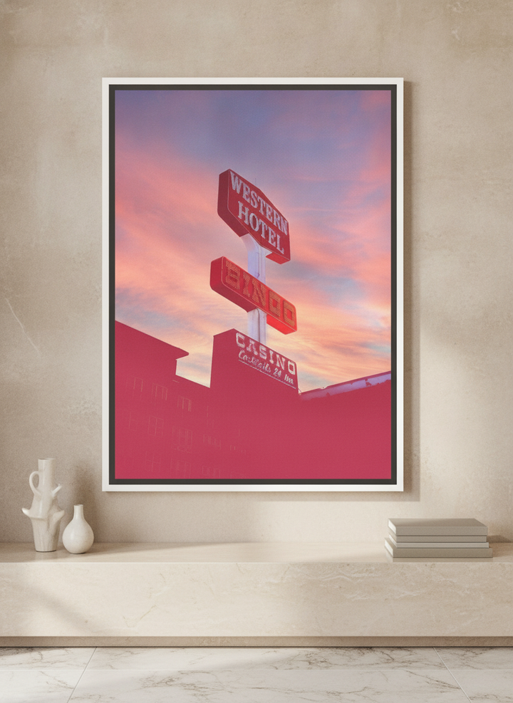 Canvas wall art with a white surround standing on a console in a luxe home office