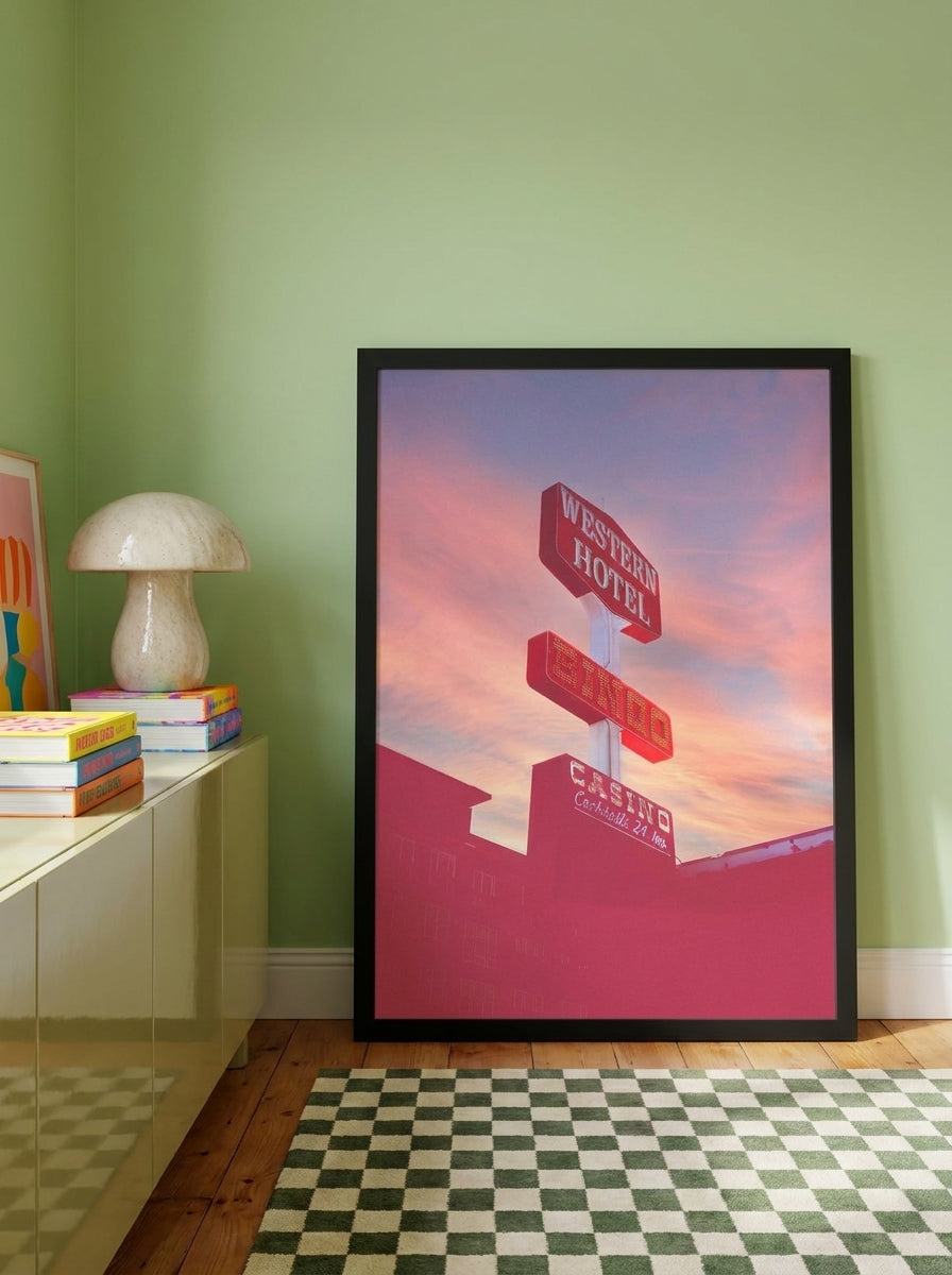 Modern wall art print standing on a sideboard in a colourful eclectic home office