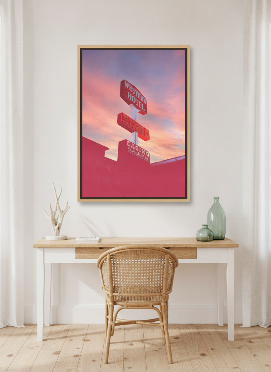 Canvas wall art with a natural timber surround styled on the wall in a coastal home office