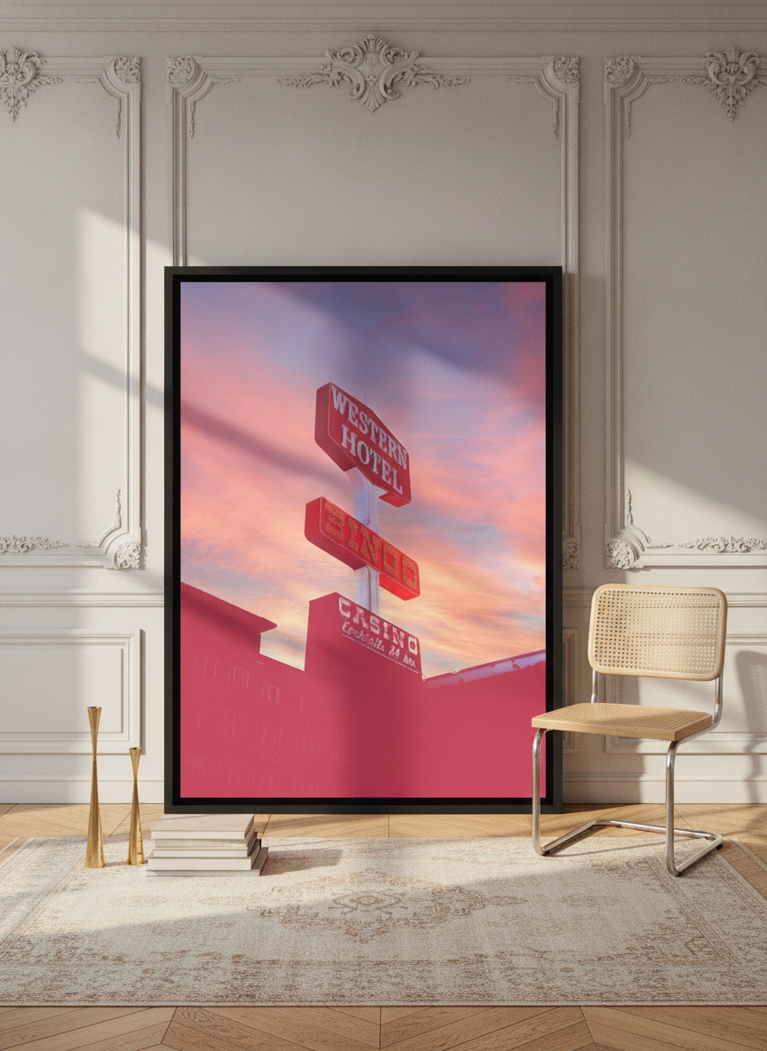 Oversized statement canvas wall art with a black surround leaning against the wall in a Parisian living room