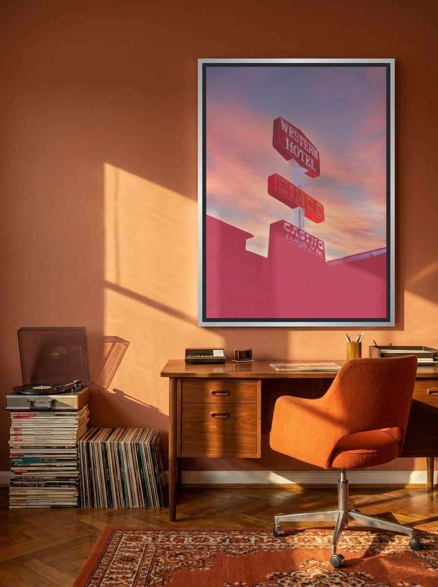 Canvas wall art with a silver leaf surround styled on the wall in a retro 70s home office