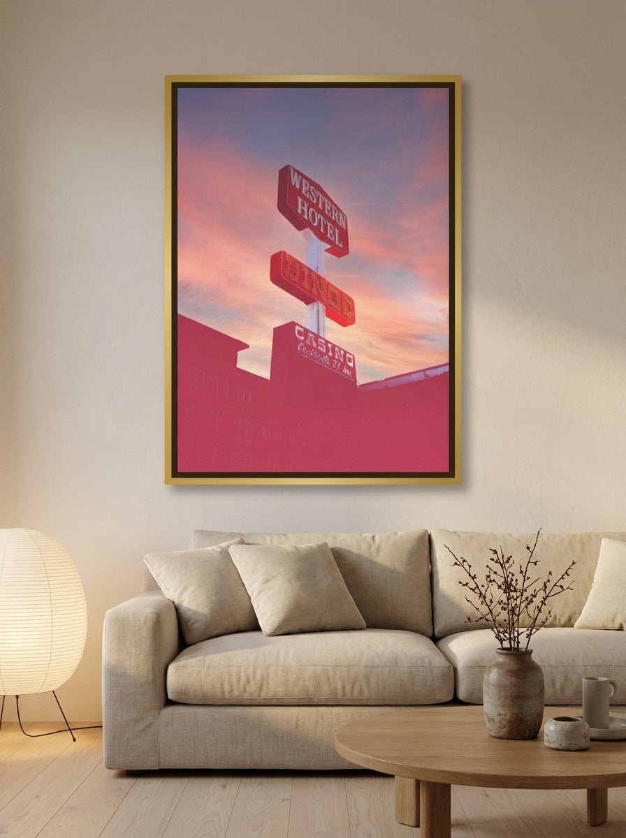 Oversized statement canvas wall art with a gold leaf surround styled on the wall in a warm Japandi living room