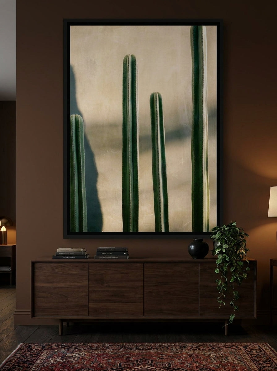 Oversized statement canvas wall art with a black surround styled on the wall in a moody living room