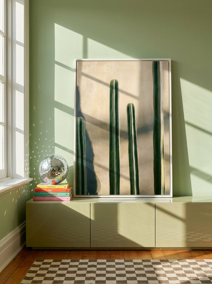 Canvas wall art with a white surround standing on a sideboard in a colourful eclectic bedroom