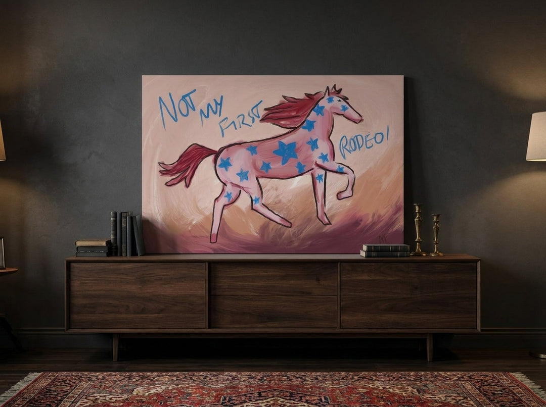 Stretched canvas wall art standing on a sideboard in a moody living room