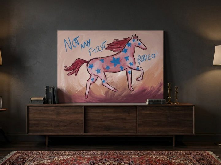 Stretched canvas wall art standing on a sideboard in a moody living room
