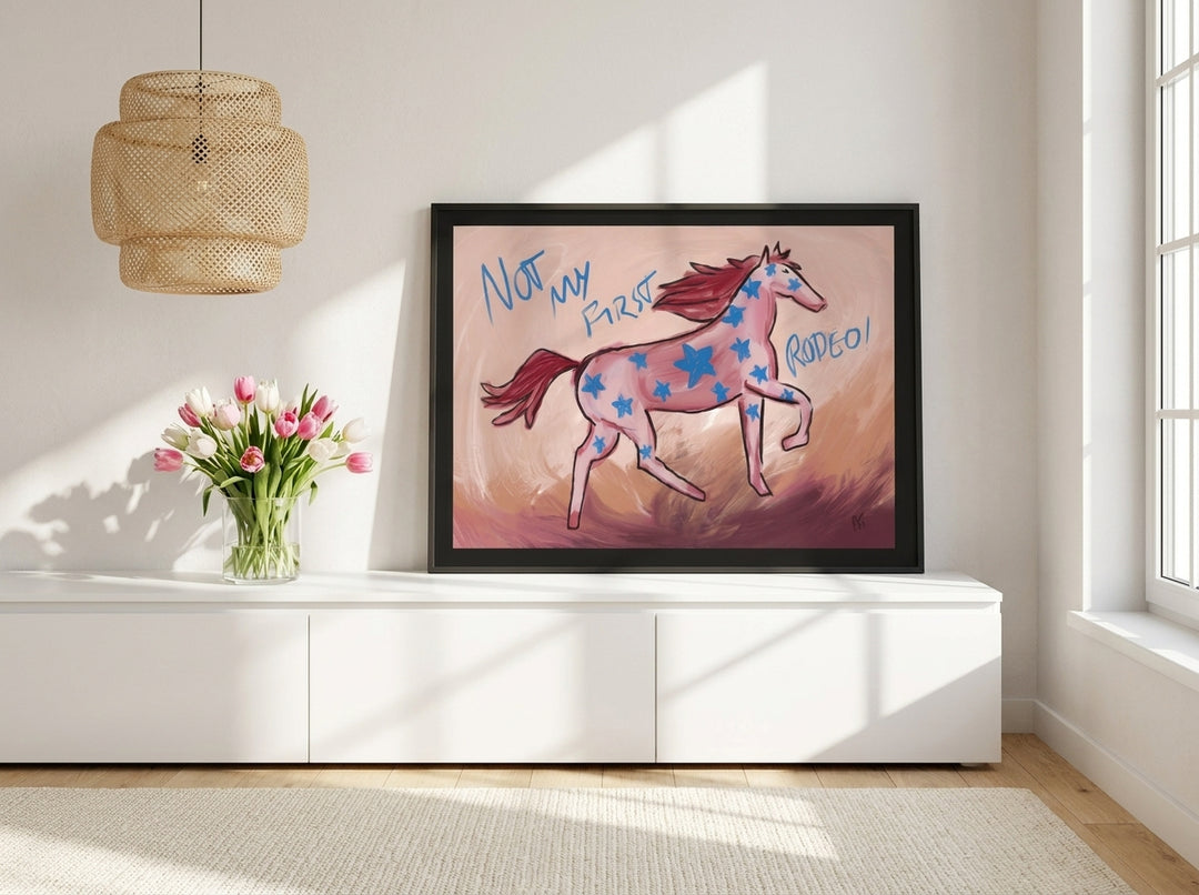 Modern wall art print standing on a sideboard in a bright Scandinavian home office