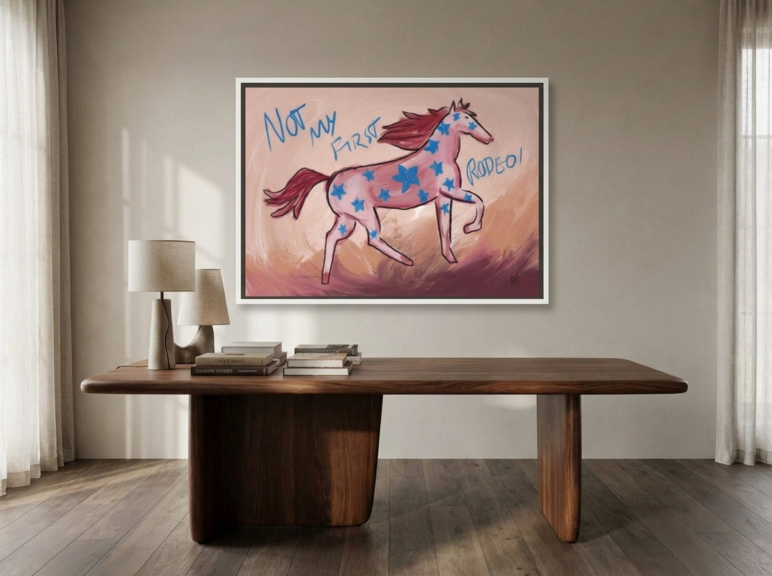 Canvas wall art with a white surround styled on the wall in a luxe home office
