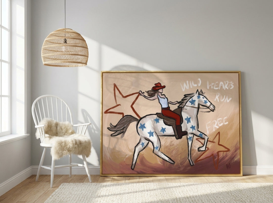 Canvas wall art with a gold leaf surround leaning against the wall in a bright Scandinavian nursery