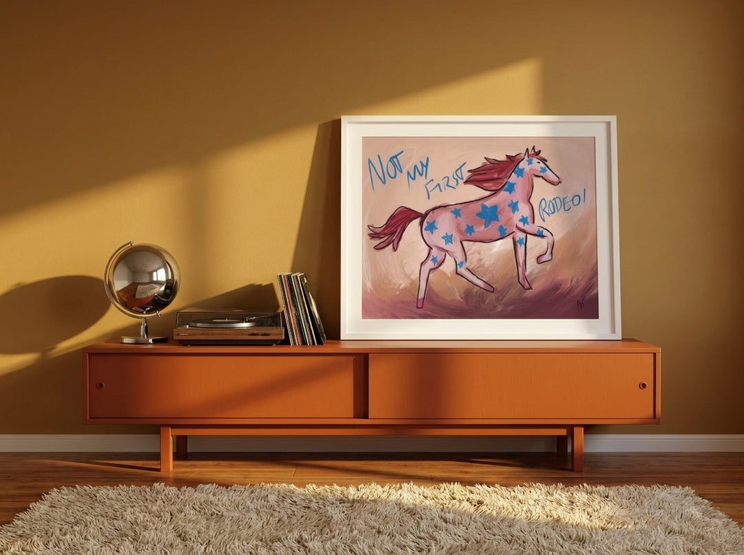 Modern wall art print standing on a sideboard in a retro 70s bedroom