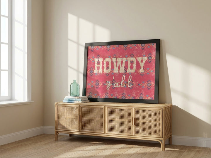 Modern wall art print standing on a sideboard in a coastal bedroom