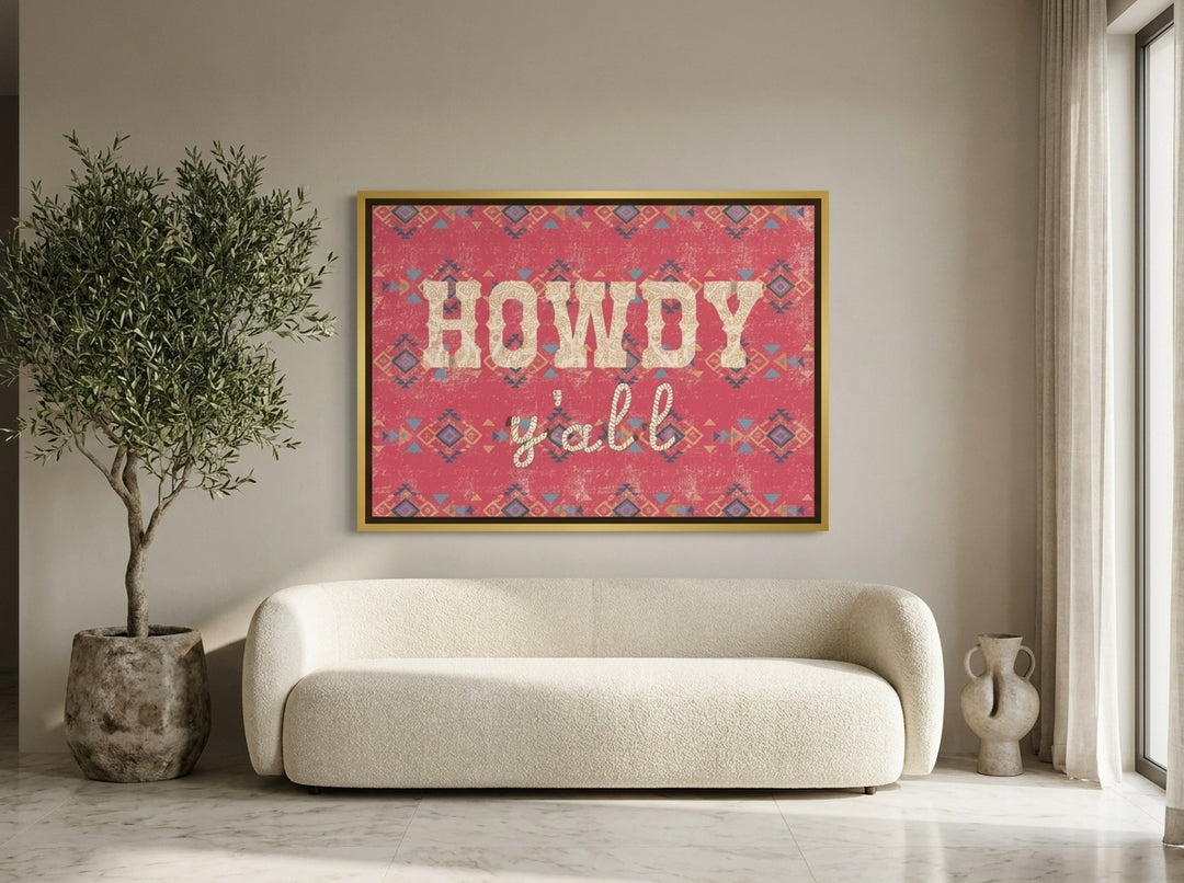 Oversized statement canvas wall art with a gold leaf surround styled on the wall in a luxe living room