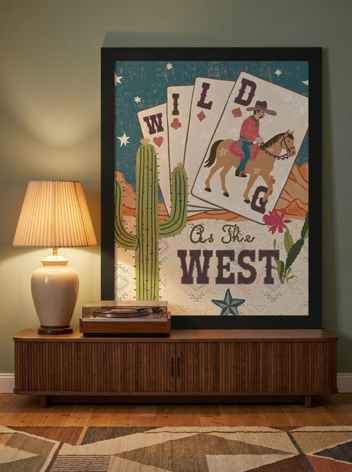 Modern wall art print standing on a sideboard in a mid-century home office