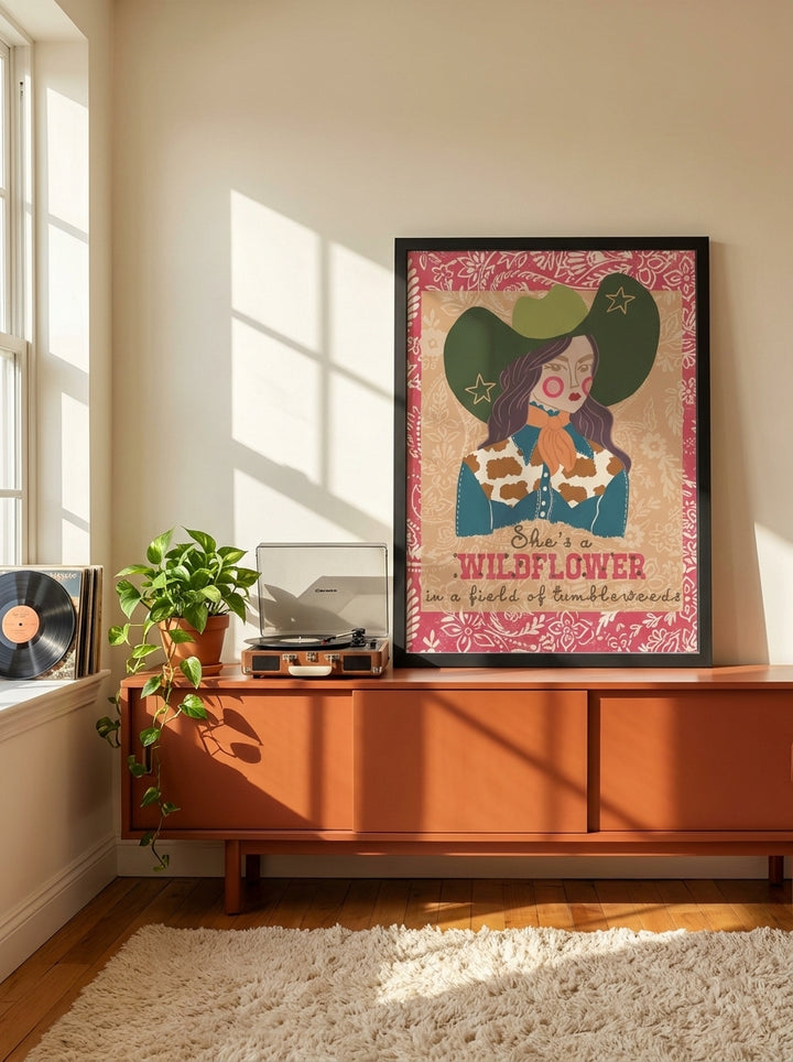 Modern wall art print standing on a sideboard in a retro 70s bedroom