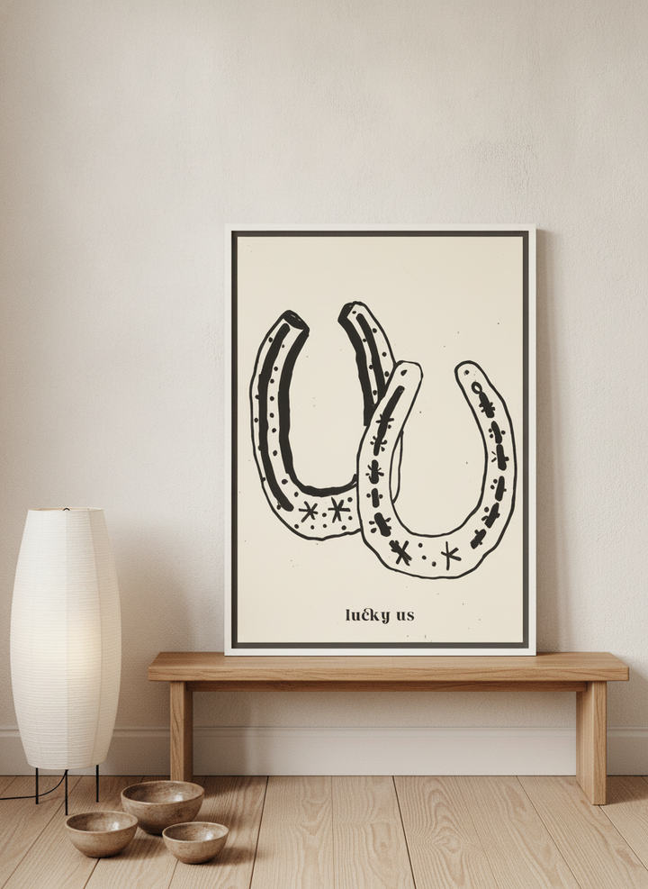 Canvas wall art with a white surround standing on a bench in a warm Japandi nursery