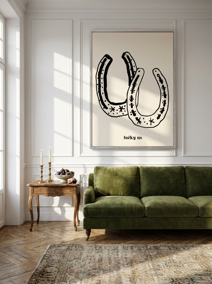 Oversized statement canvas wall art with a silver leaf surround styled on the wall in a Parisian living room