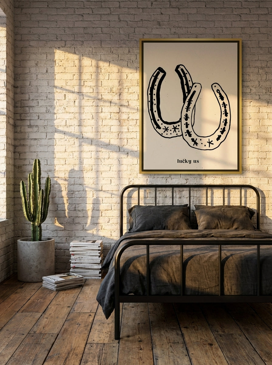 Canvas wall art with a gold leaf surround styled on the wall in an industrial loft bedroom
