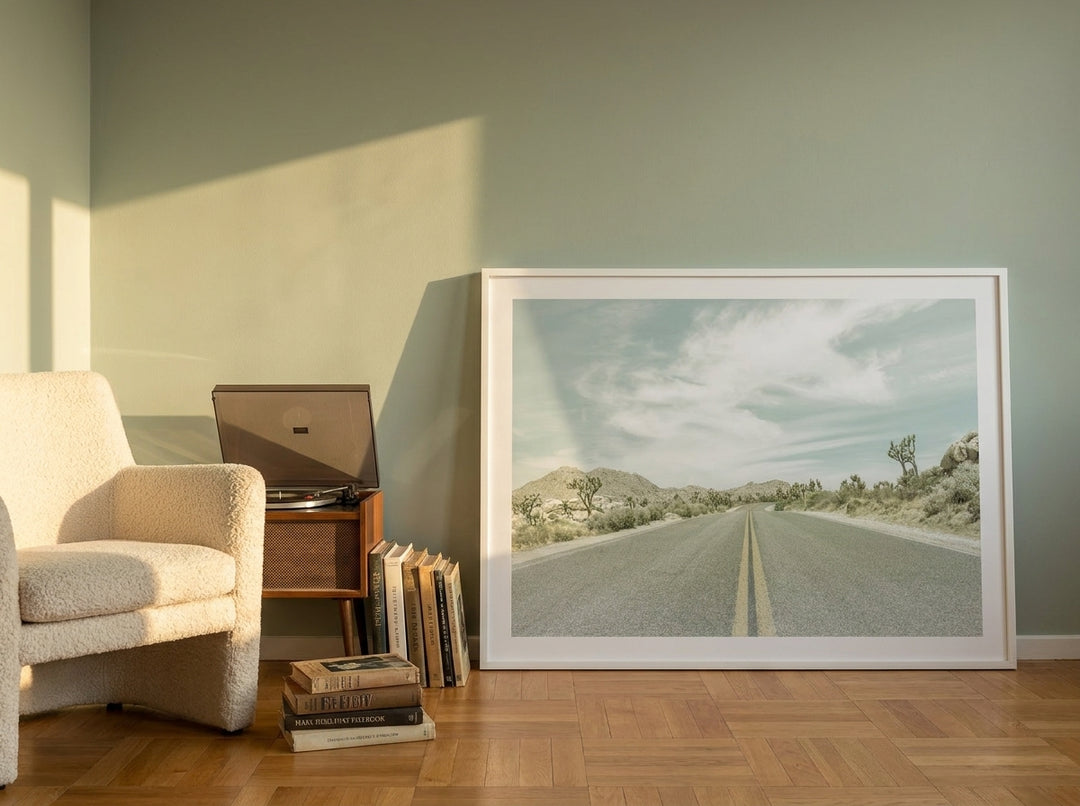 Modern wall art print leaning against the wall in a mid-century bedroom