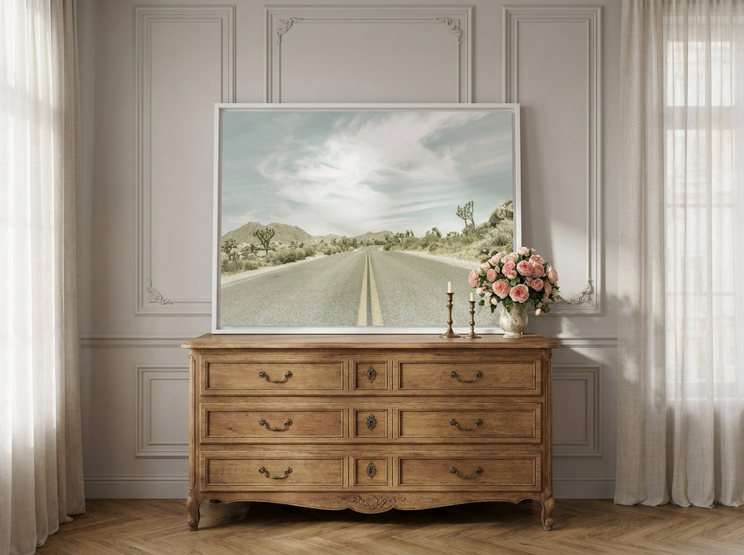 Canvas wall art with a white surround standing on a sideboard in a Parisian home office