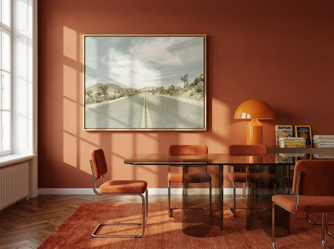 Oversized statement canvas wall art with a natural timber surround styled on the wall in a retro 70s dining room