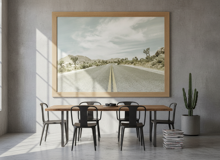 Oversized statement modern wall art print styled on the wall in an industrial loft dining room