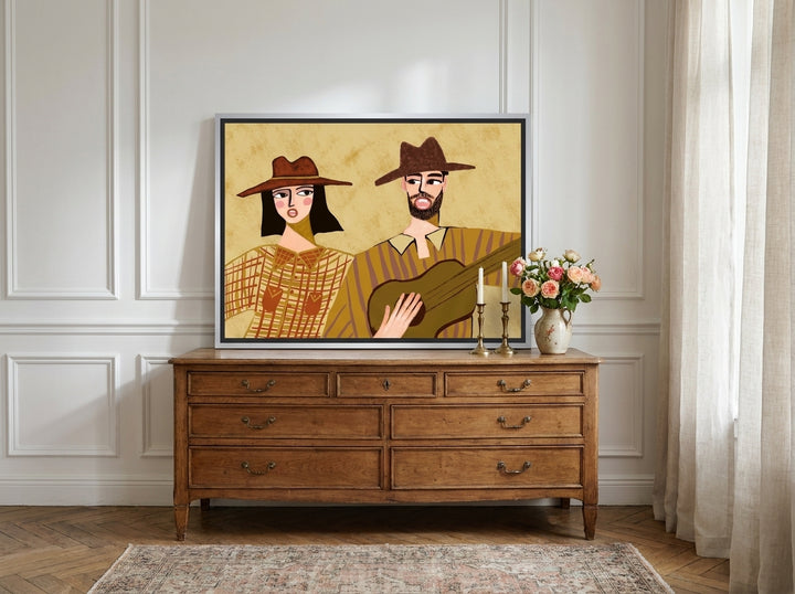 Canvas wall art with a silver leaf surround standing on a sideboard in a Parisian dining room