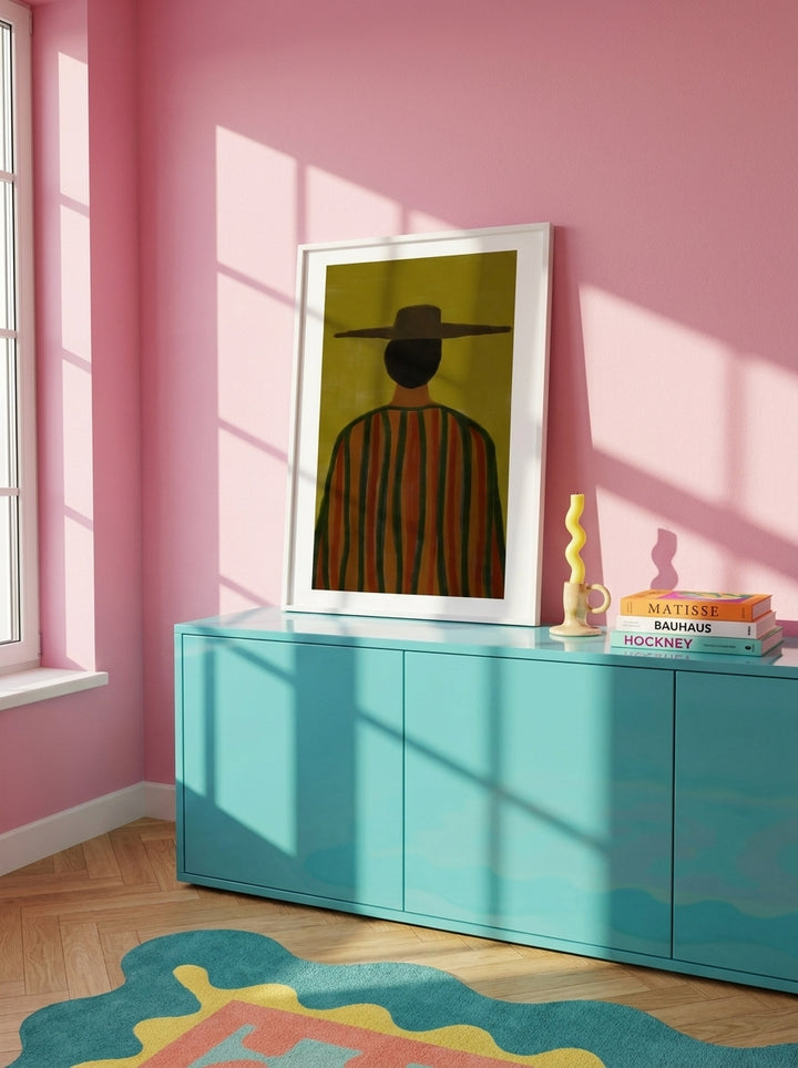 Modern wall art print standing on a sideboard in a colourful eclectic home office