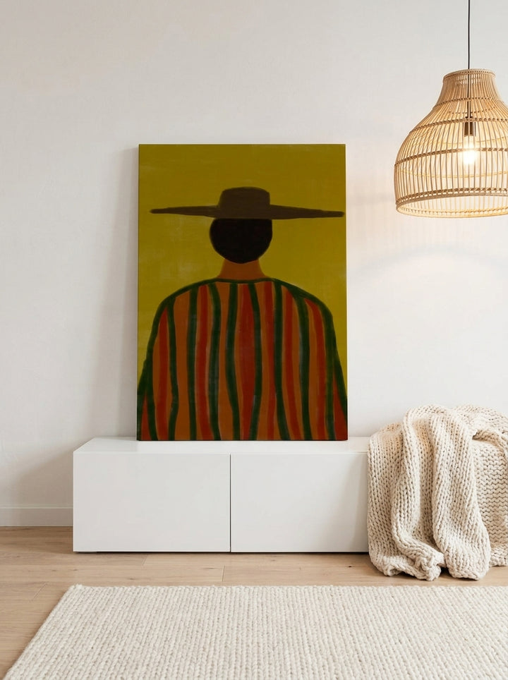 Stretched canvas wall art standing on a sideboard in a bright Scandinavian home office