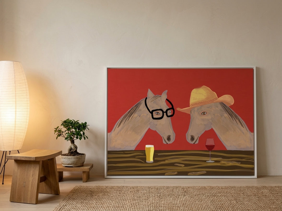 Canvas wall art with a white surround leaning against the wall in a warm Japandi kitchen