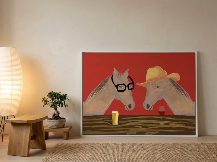 Canvas wall art with a white surround leaning against the wall in a warm Japandi kitchen