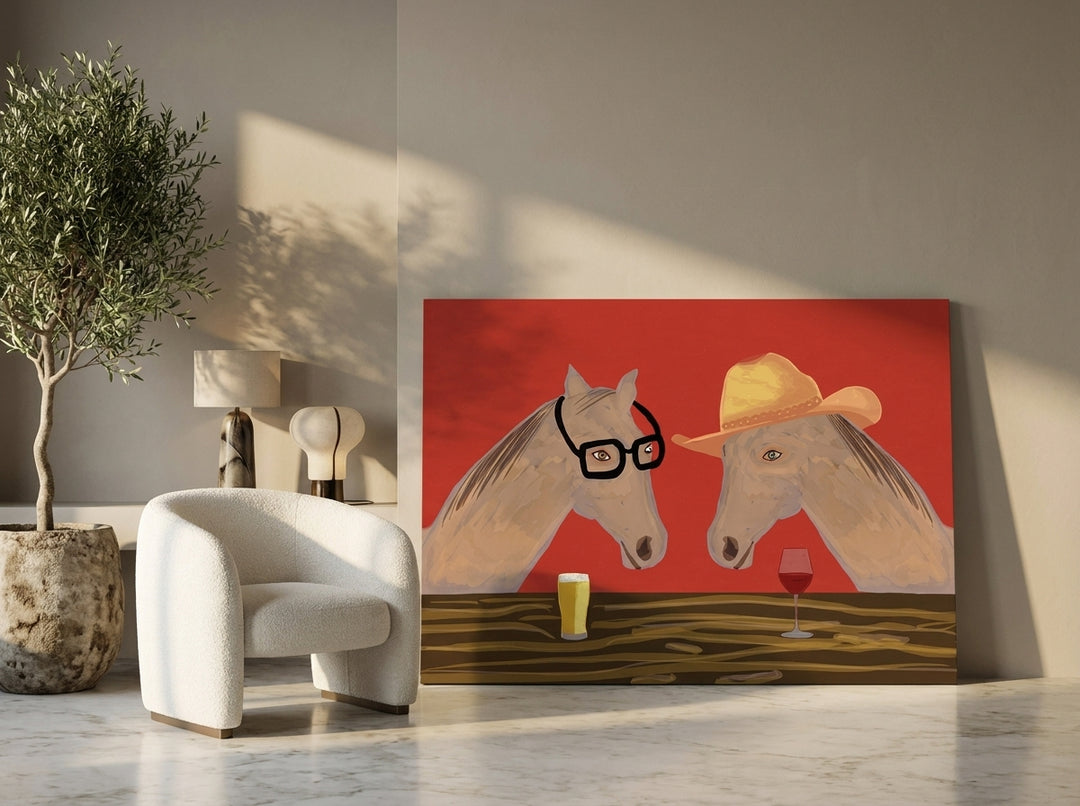 Stretched canvas wall art leaning against the wall in a luxe living room