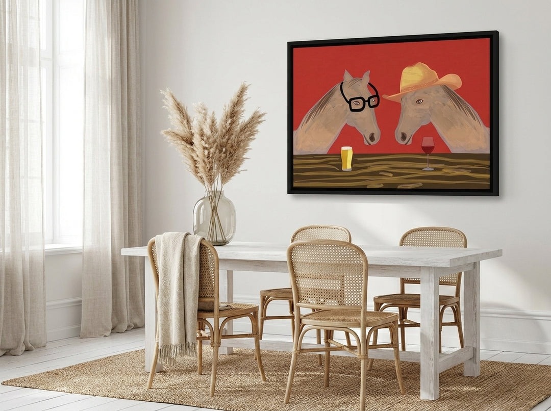 Canvas wall art with a black surround styled on the wall in a coastal dining room
