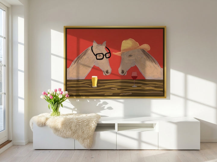 Oversized statement canvas wall art with a gold leaf surround styled on the wall in a bright Scandinavian living room