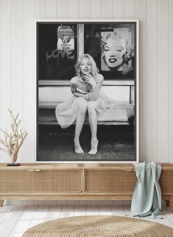 Canvas wall art with a white surround standing on a sideboard in a coastal home office