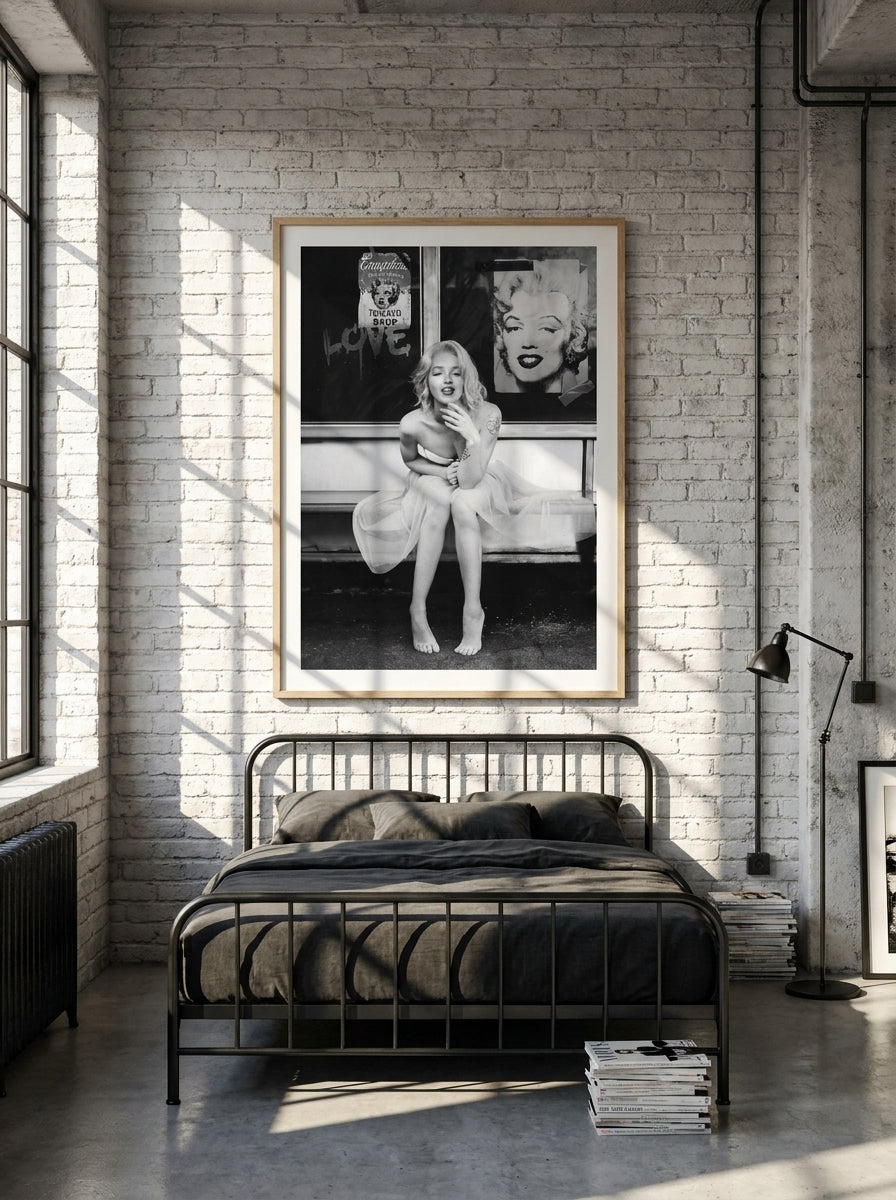 Modern wall art print styled on the wall in an industrial loft bedroom