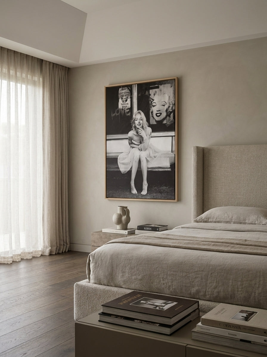 Oversized statement canvas wall art with a natural timber surround styled on the wall in a luxe bedroom