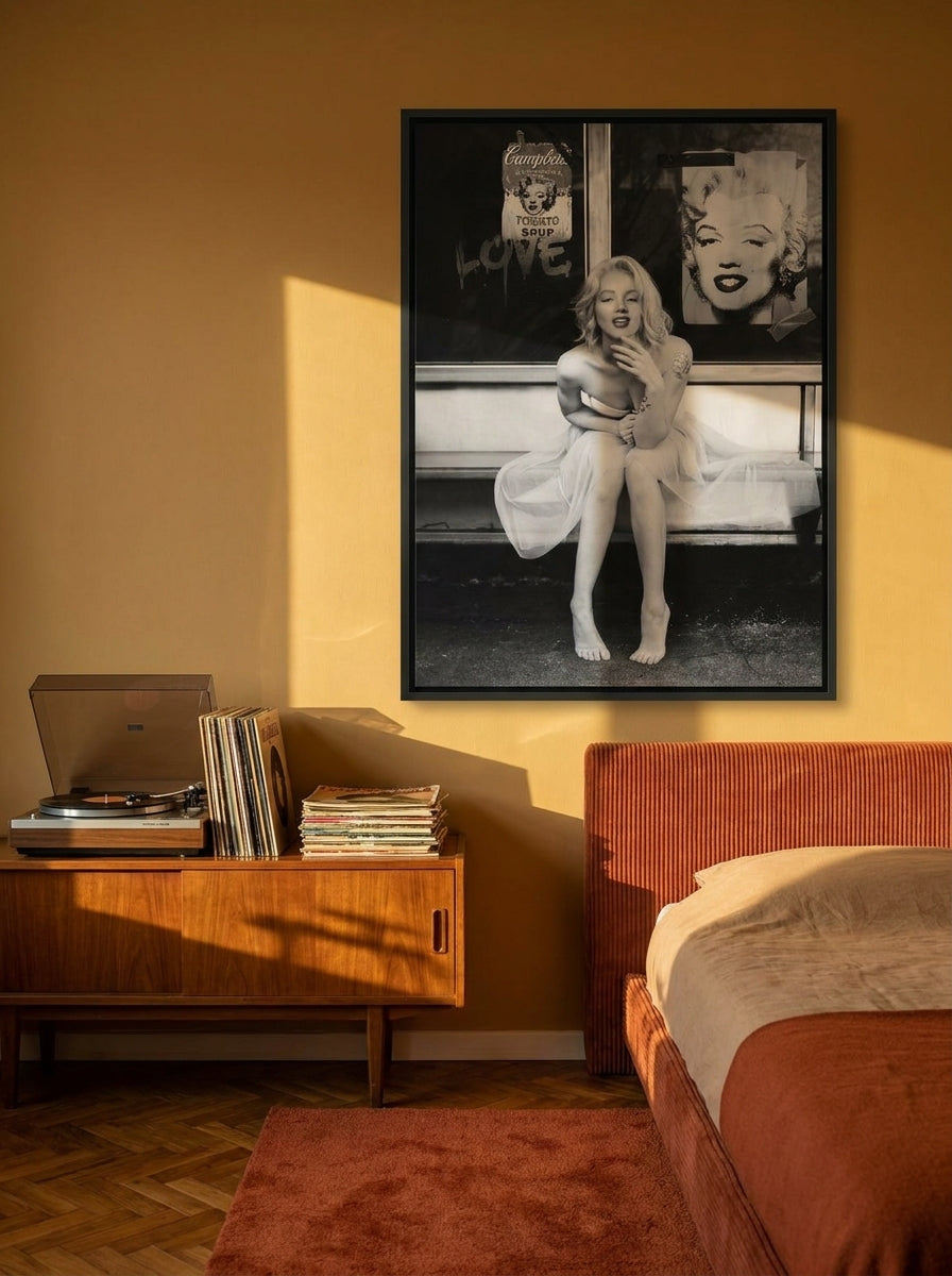 Canvas wall art with a black surround styled on the wall in a retro 70s bedroom