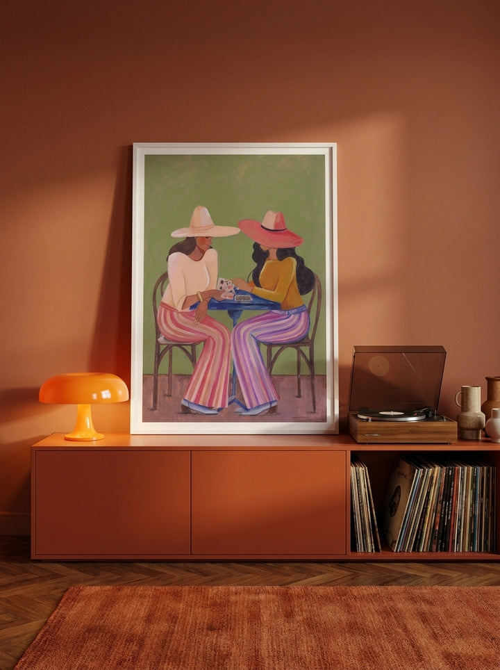 Modern wall art print standing on a sideboard in a retro 70s bedroom