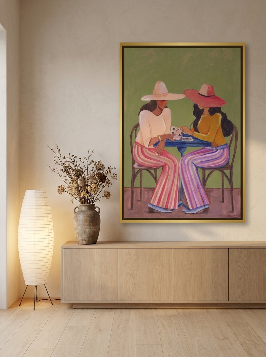 Oversized statement canvas wall art with a gold leaf surround styled on the wall in a warm Japandi living room