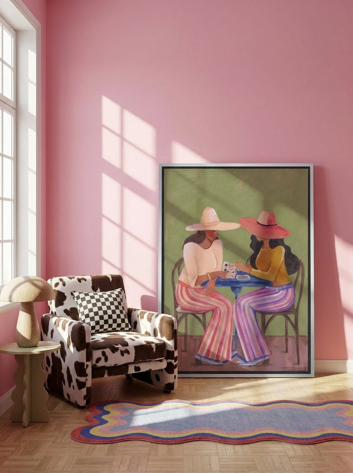 Canvas wall art with a silver leaf surround leaning against the wall in a colourful eclectic bedroom