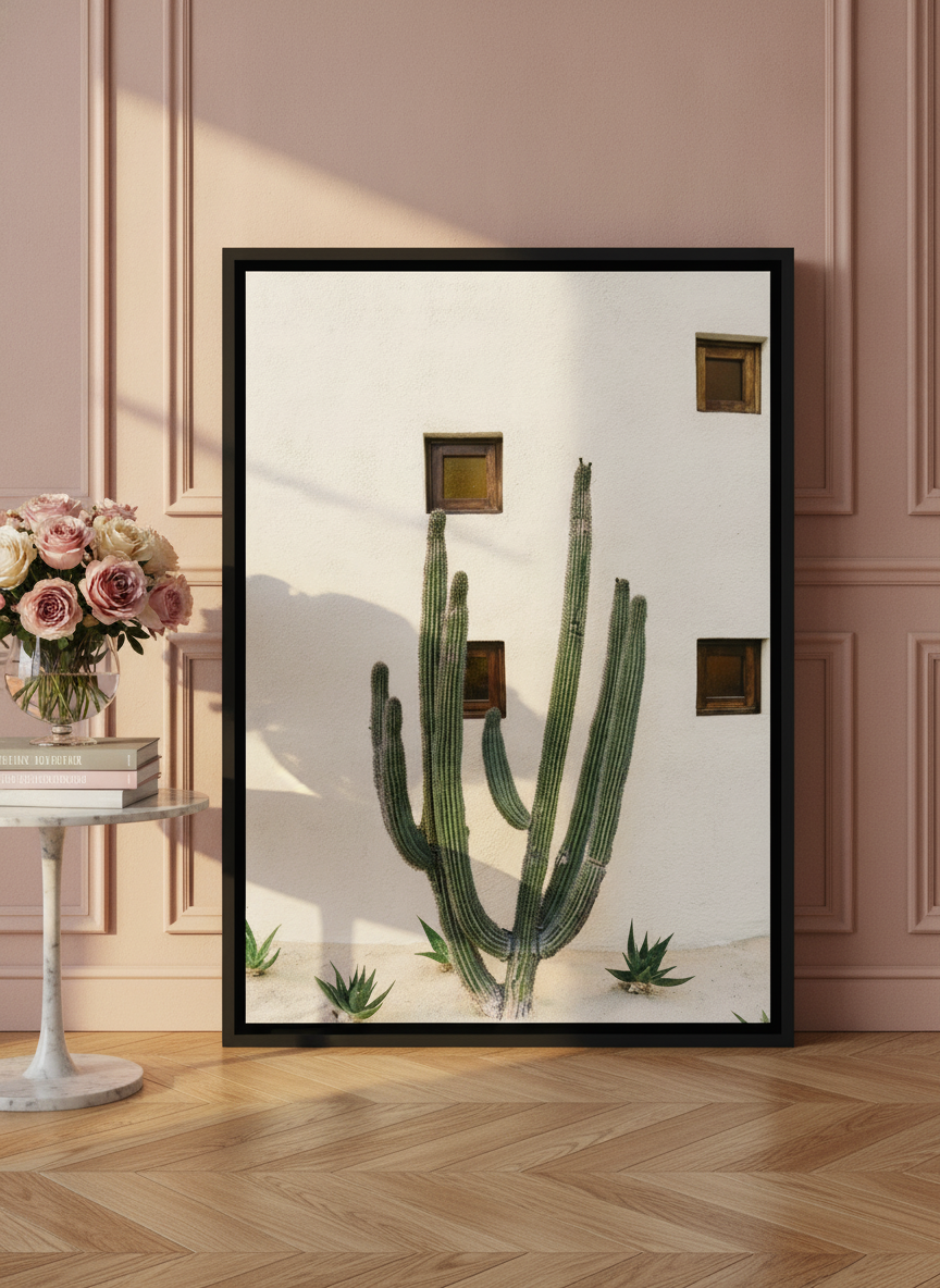 Canvas wall art with a black surround leaning against the wall in a Parisian living room
