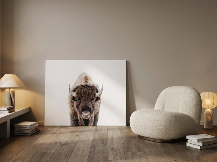 Stretched canvas wall art leaning against the wall in a luxe living room