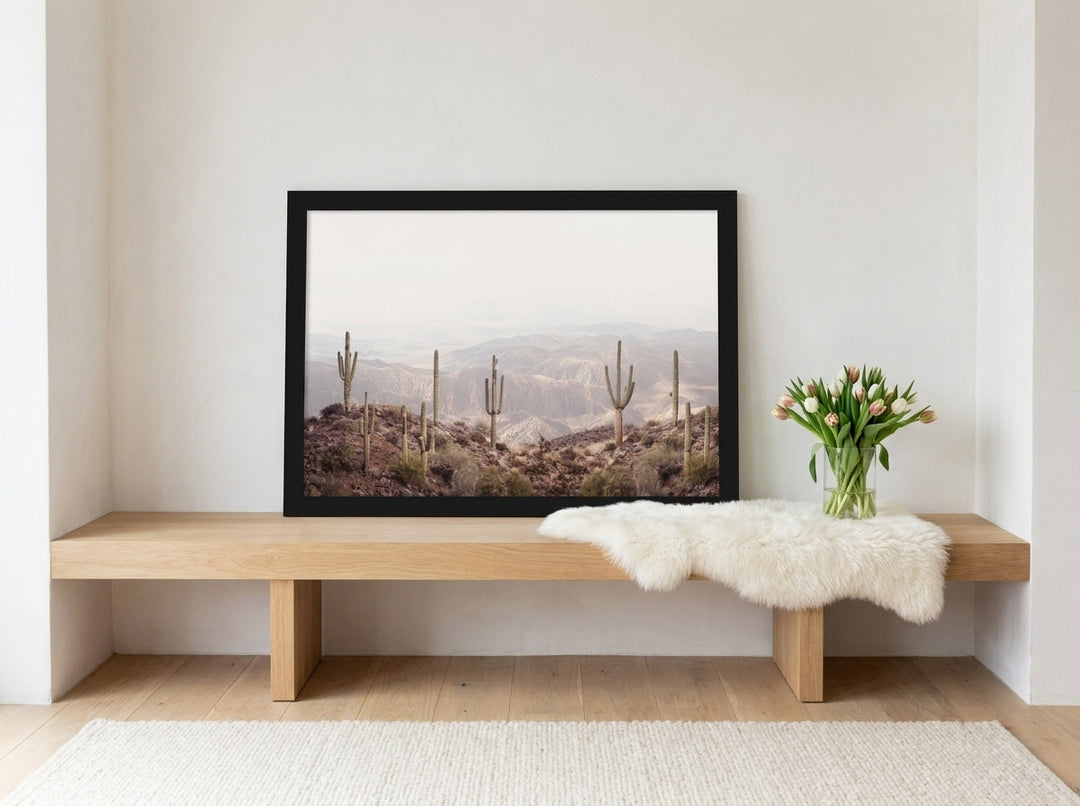 Modern wall art print standing on a bench in a bright Scandinavian living room
