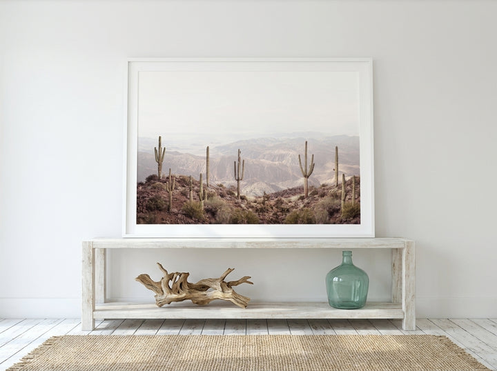 Modern wall art print standing on a console in a coastal home office