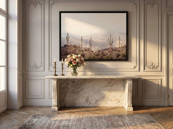 Canvas wall art with a black surround styled on the wall in a Parisian living room