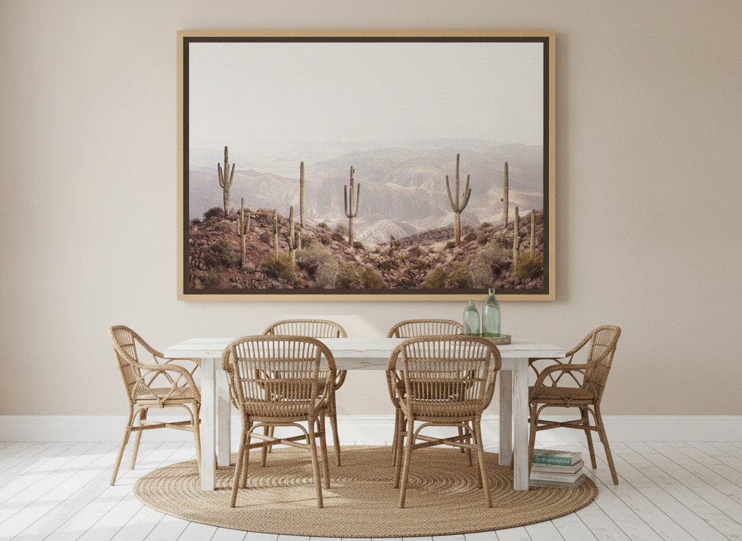 Oversized statement canvas wall art with a natural timber surround styled on the wall in a coastal dining room