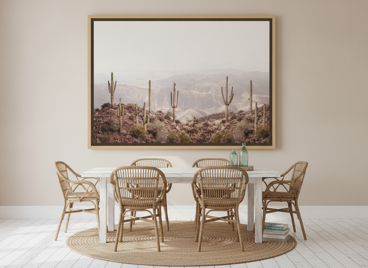 Oversized statement canvas wall art with a natural timber surround styled on the wall in a coastal dining room