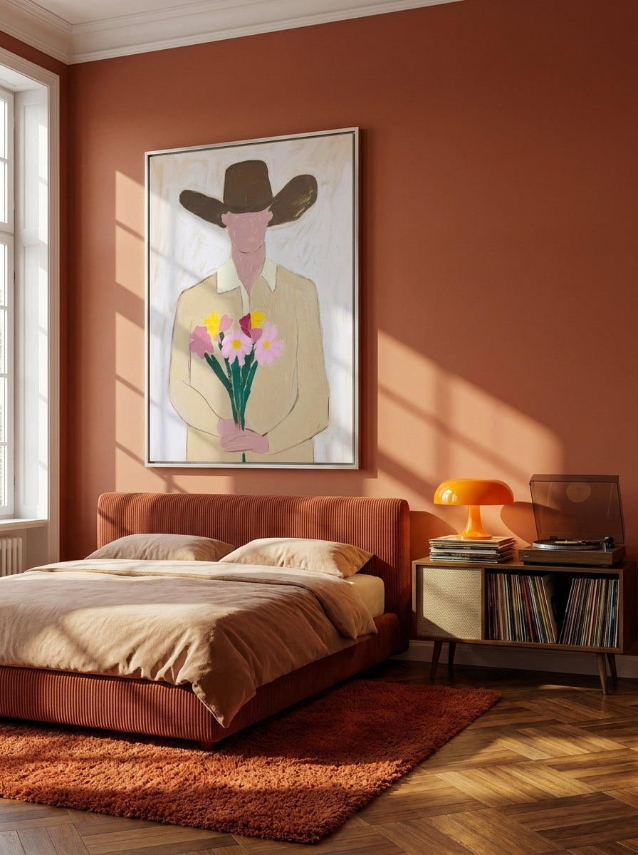 Oversized statement canvas wall art with a silver leaf surround styled on the wall in a retro 70s bedroom