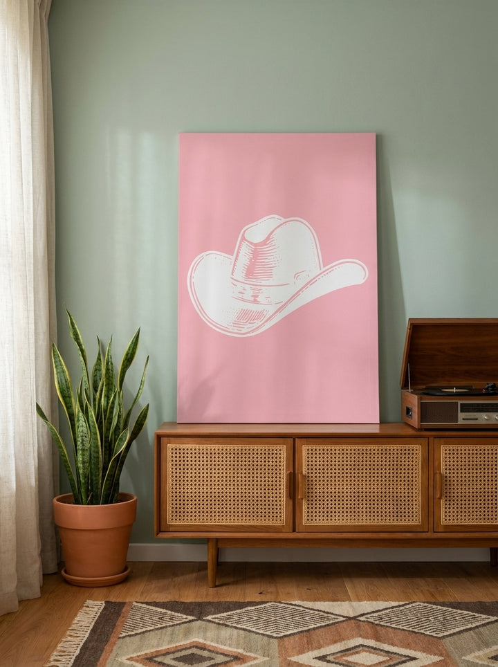 Stretched canvas wall art standing on a sideboard in a mid-century bedroom